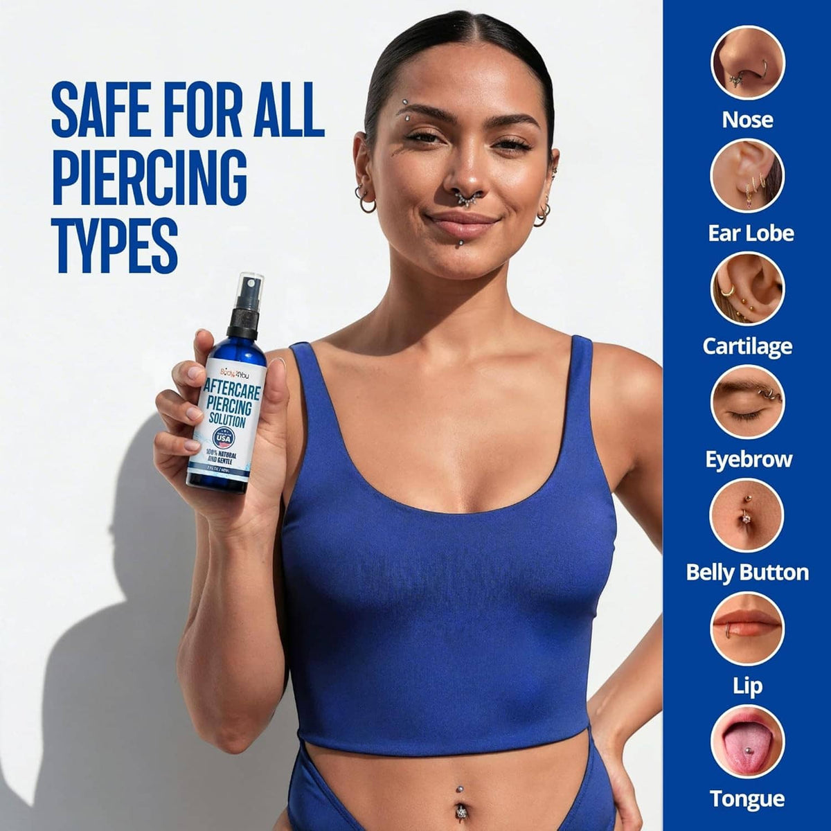 Piercing aftercare saline spray held by woman with navel piercing and ear piercings