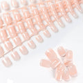 Pink short press-on nails with white French tips, glossy square shape
