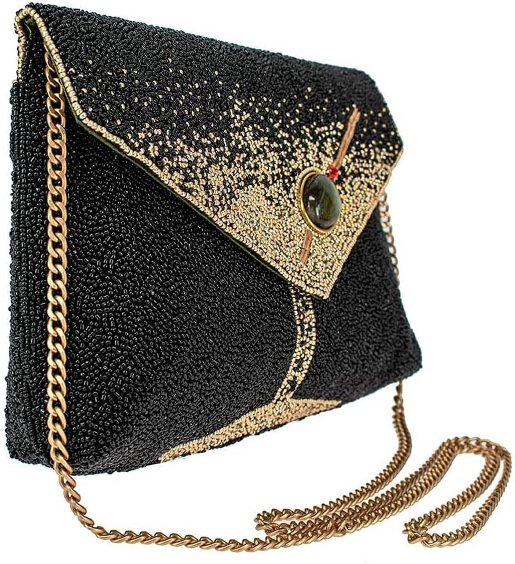 Black beaded clutch with gold diamond trim, oval gem clasp, and gold chain strap