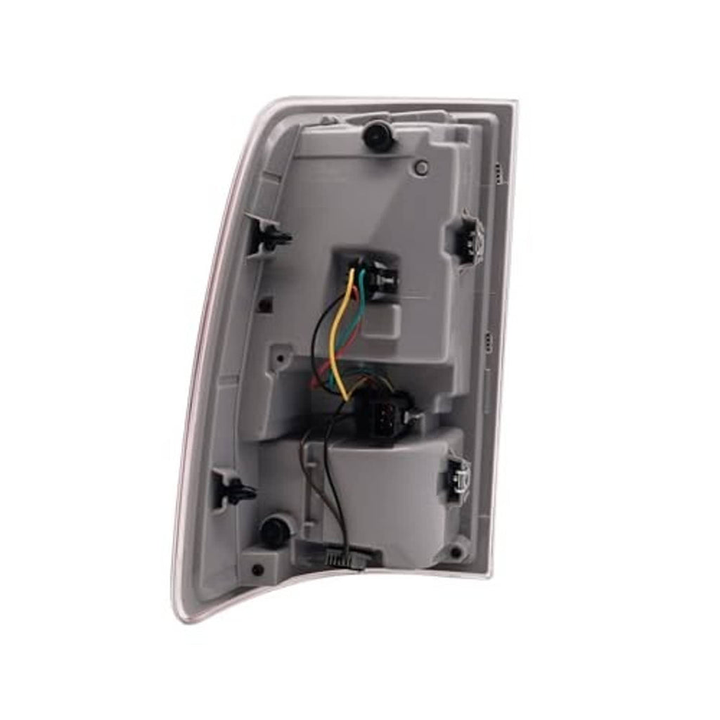 Tail light housing interior with bulb sockets, wiring, and connector ports.