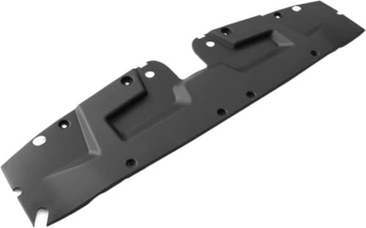Black radiator support cover with central grille-like opening and mounting tabs