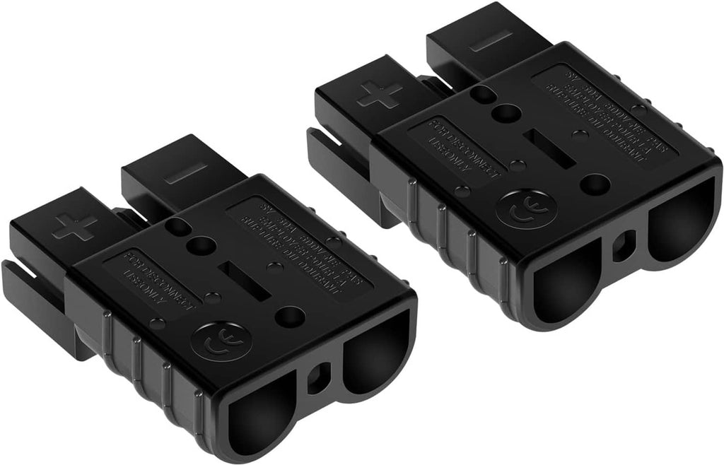 Two black quick connect plug housings with terminal openings and ridged grips
