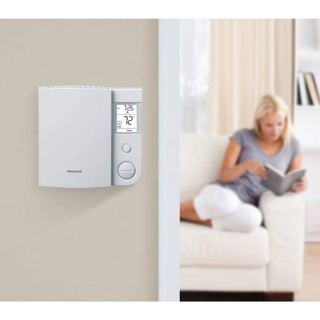 Wall-mounted white Honeywell Home programmable thermostat with digital display and buttons
