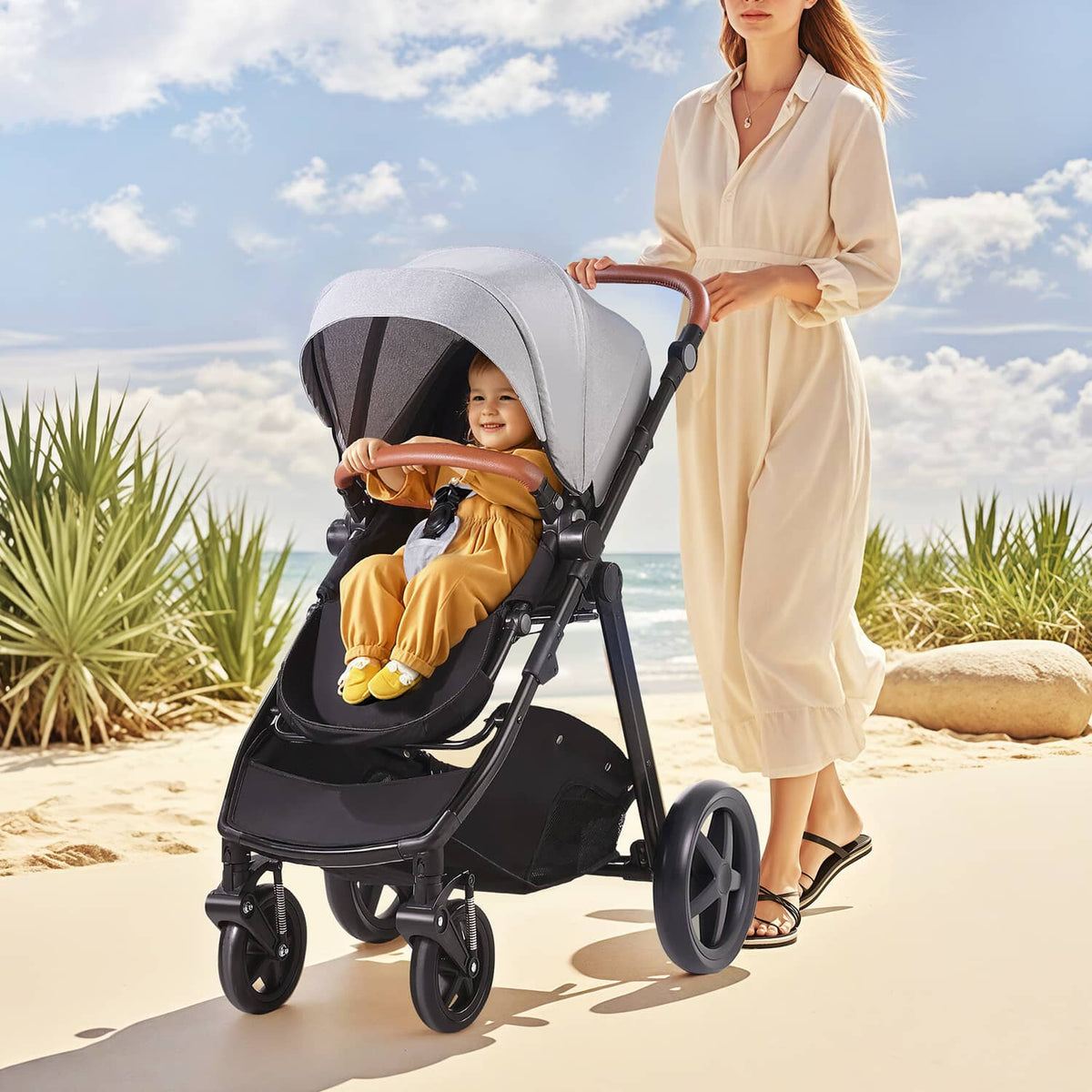 Light gray stroller with black seat and bassinet, child seated outdoors