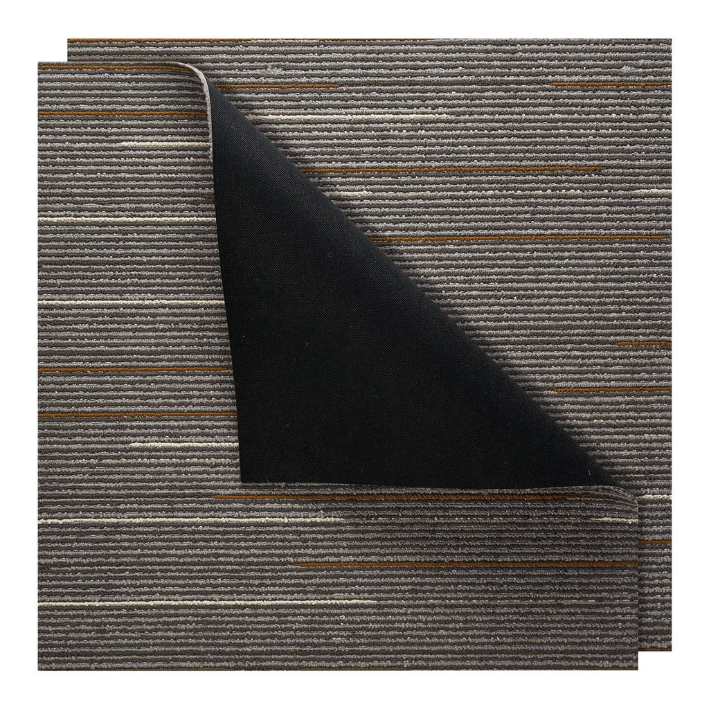 Brown carpet tile with corner fold showing textured surface and dark backing