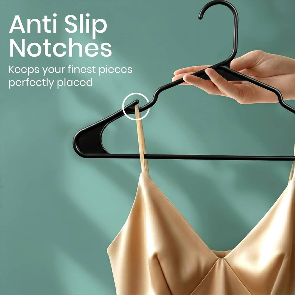 Black plastic hanger with notched shoulders and a hanging garment, anti-slip grip.