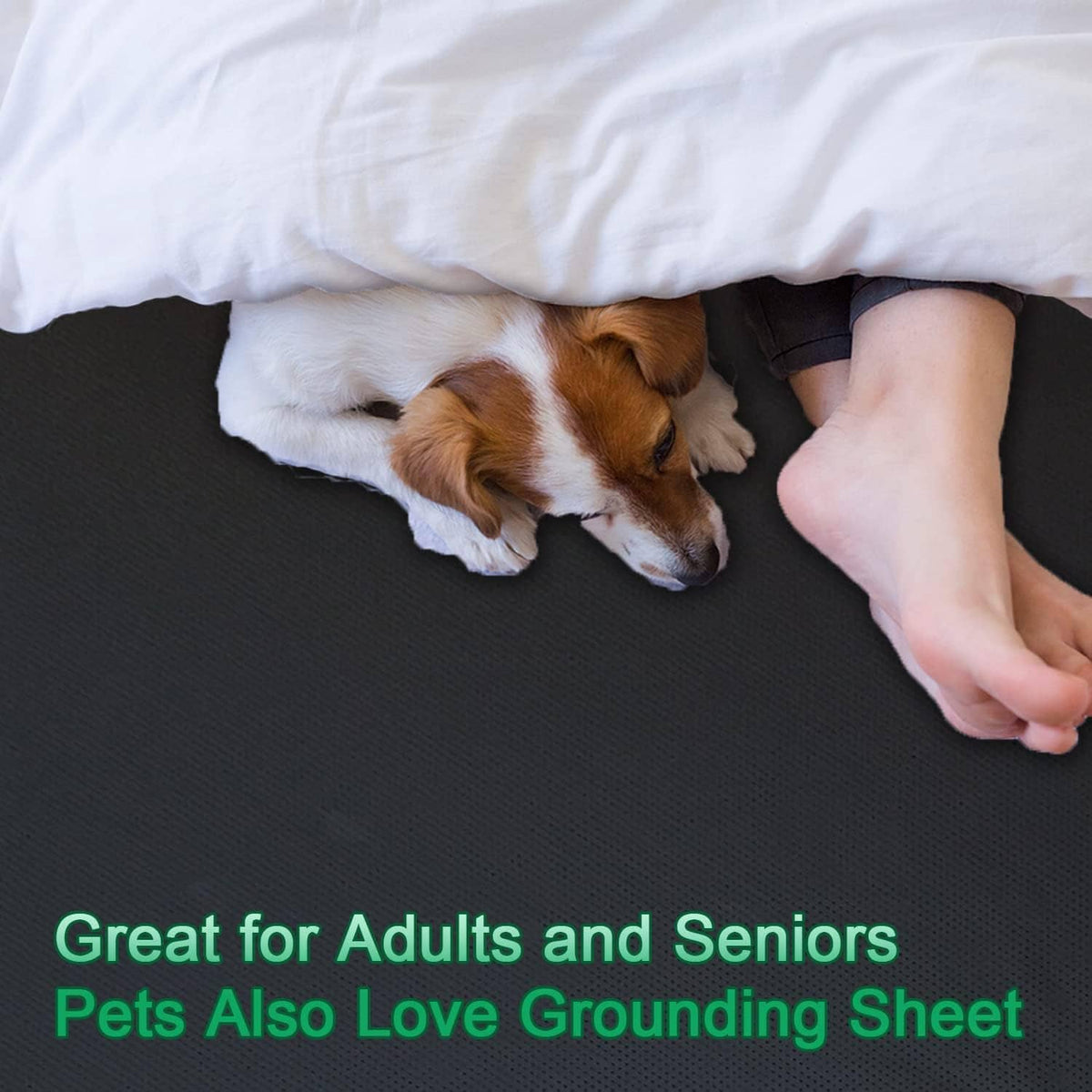 Dark grounding mattress pad on bed with dog resting and hand near edge