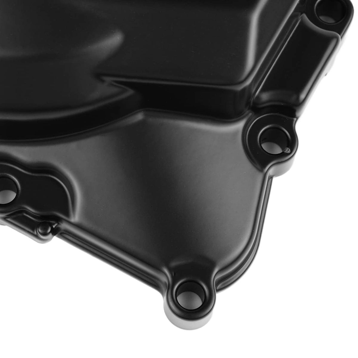 Black engine cover corner with mounting holes and screw bosses