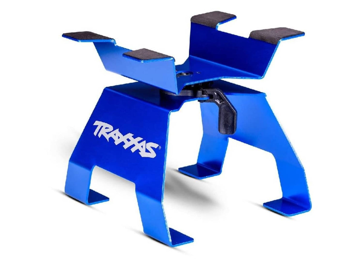 Blue TRAXXAS X-Truck stand with four raised pads and center post