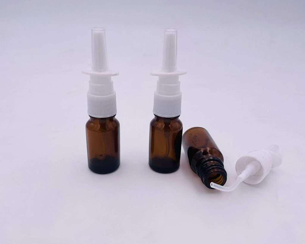 Amber glass nasal bottle set with white pumps and one nozzle applicator included