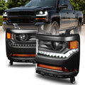 Pair of black headlight assemblies with amber turn and white LED-style DRL lights