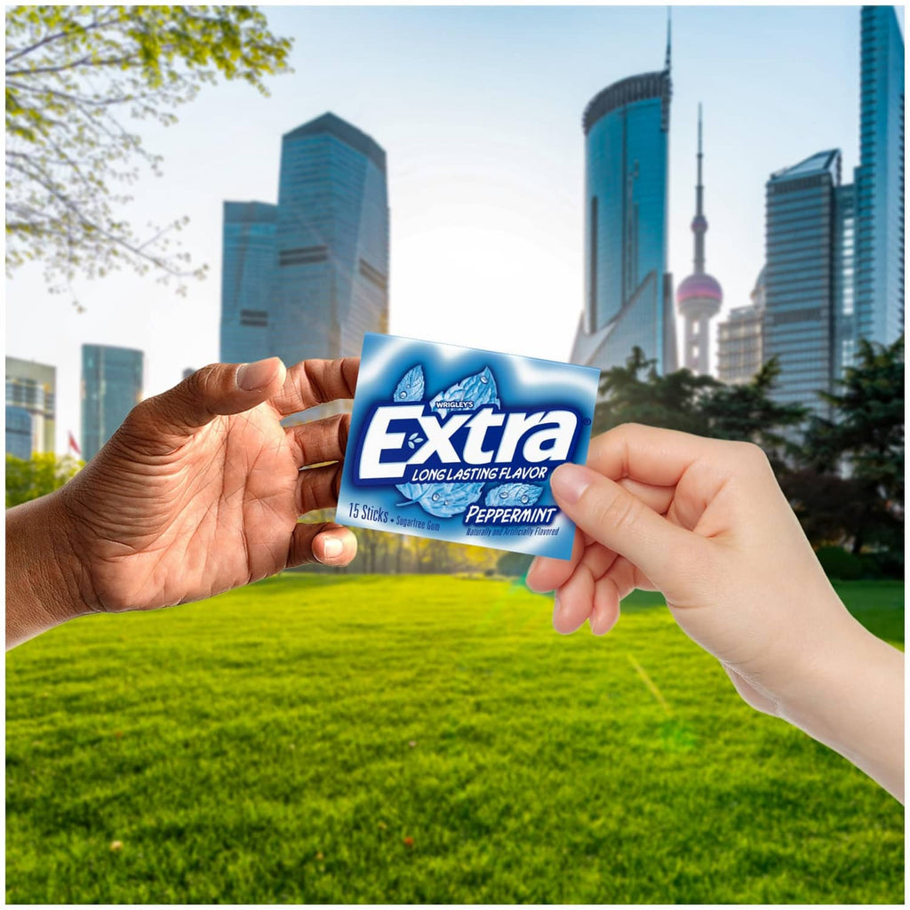 Extra peppermint gum pack held in hands, 15 sticks