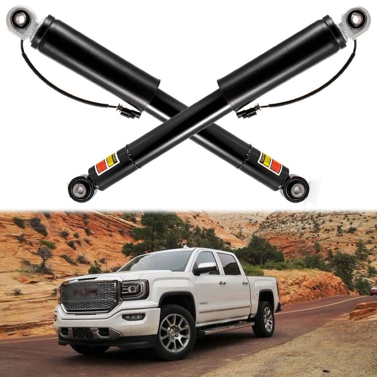 Pair of black rear shock absorbers with upper eyelet mounts and attached wiring harness