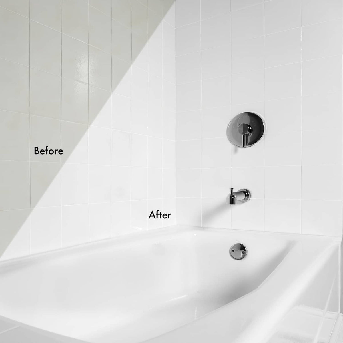 Gloss white tub and tile finish on white bathtub interior and wall controls