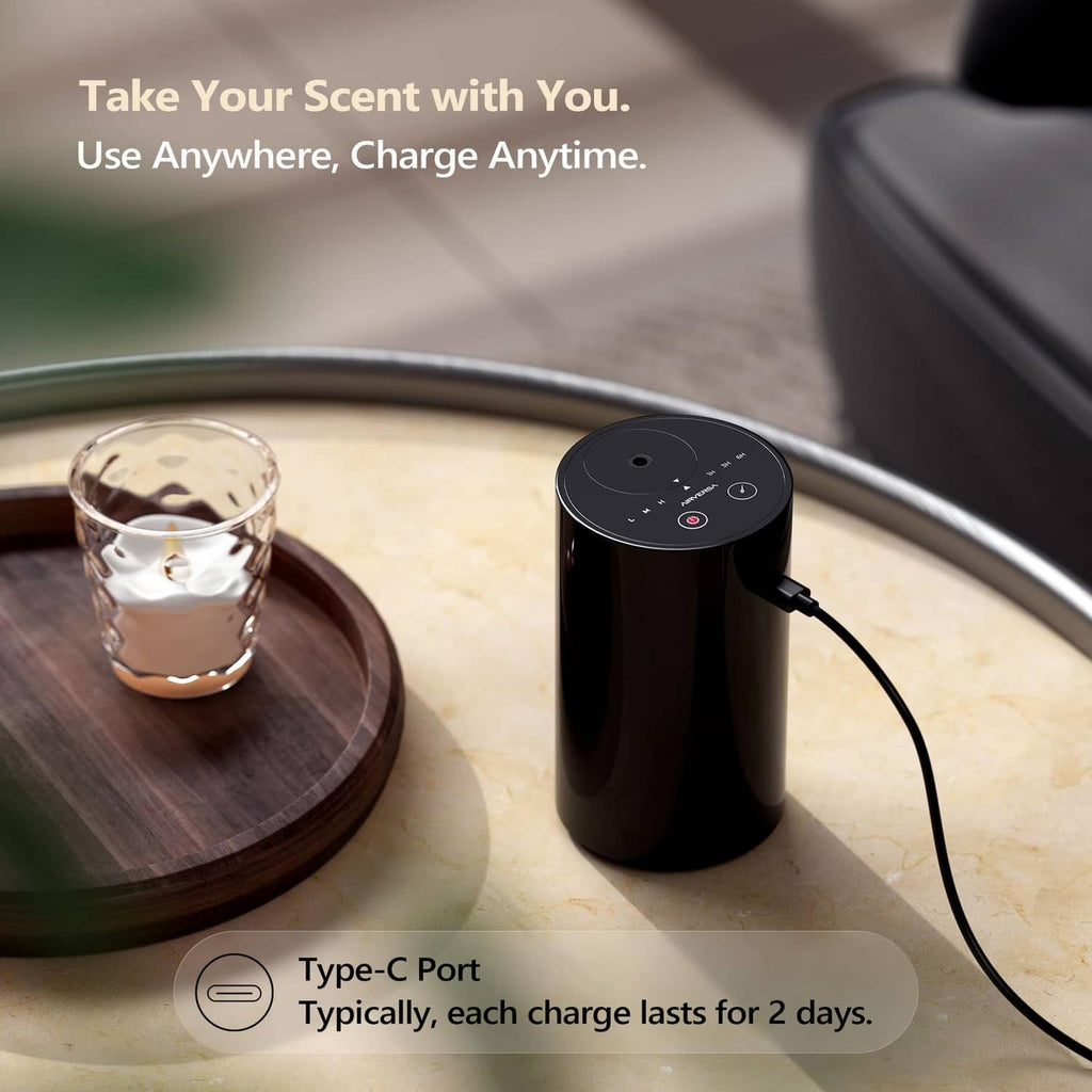 Black waterless essential oil diffuser with side charging cable connected