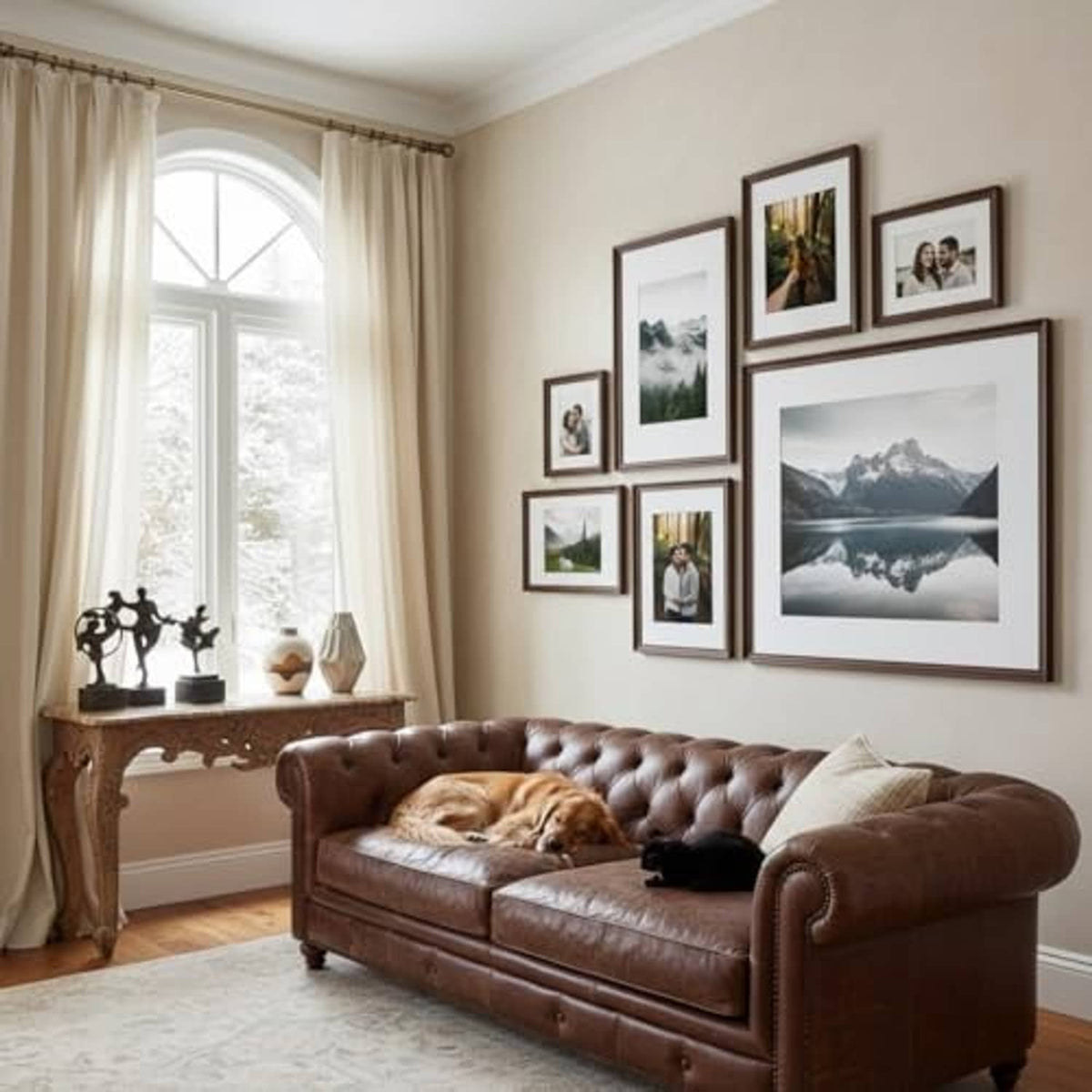 Walnut wood picture frames gallery wall with multiple photos above a brown sofa