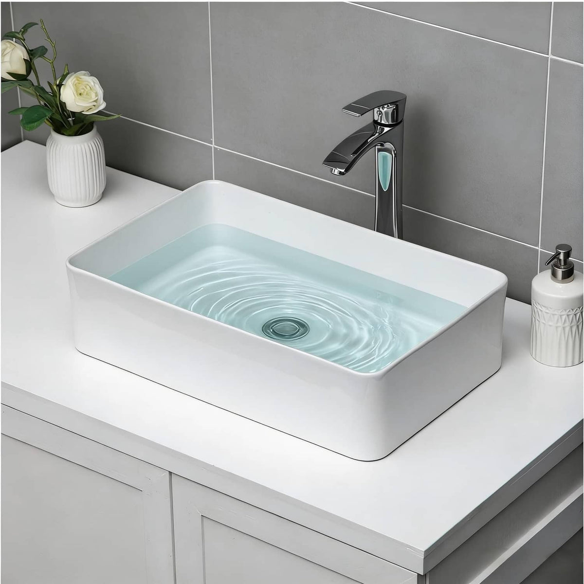 White rectangular bathroom vessel sink with centered drain hole, glossy ceramic basin