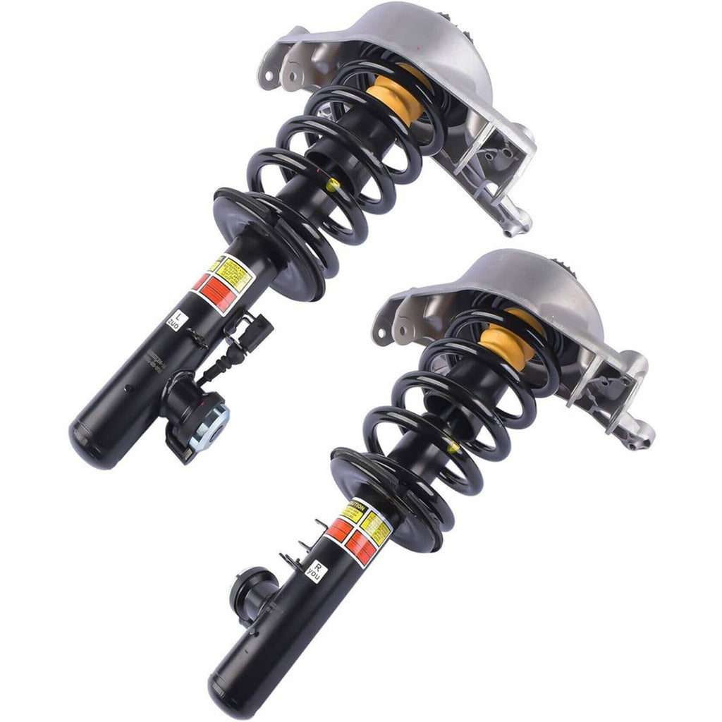 Pair of front shock struts with coil springs, silver brackets, and yellow label