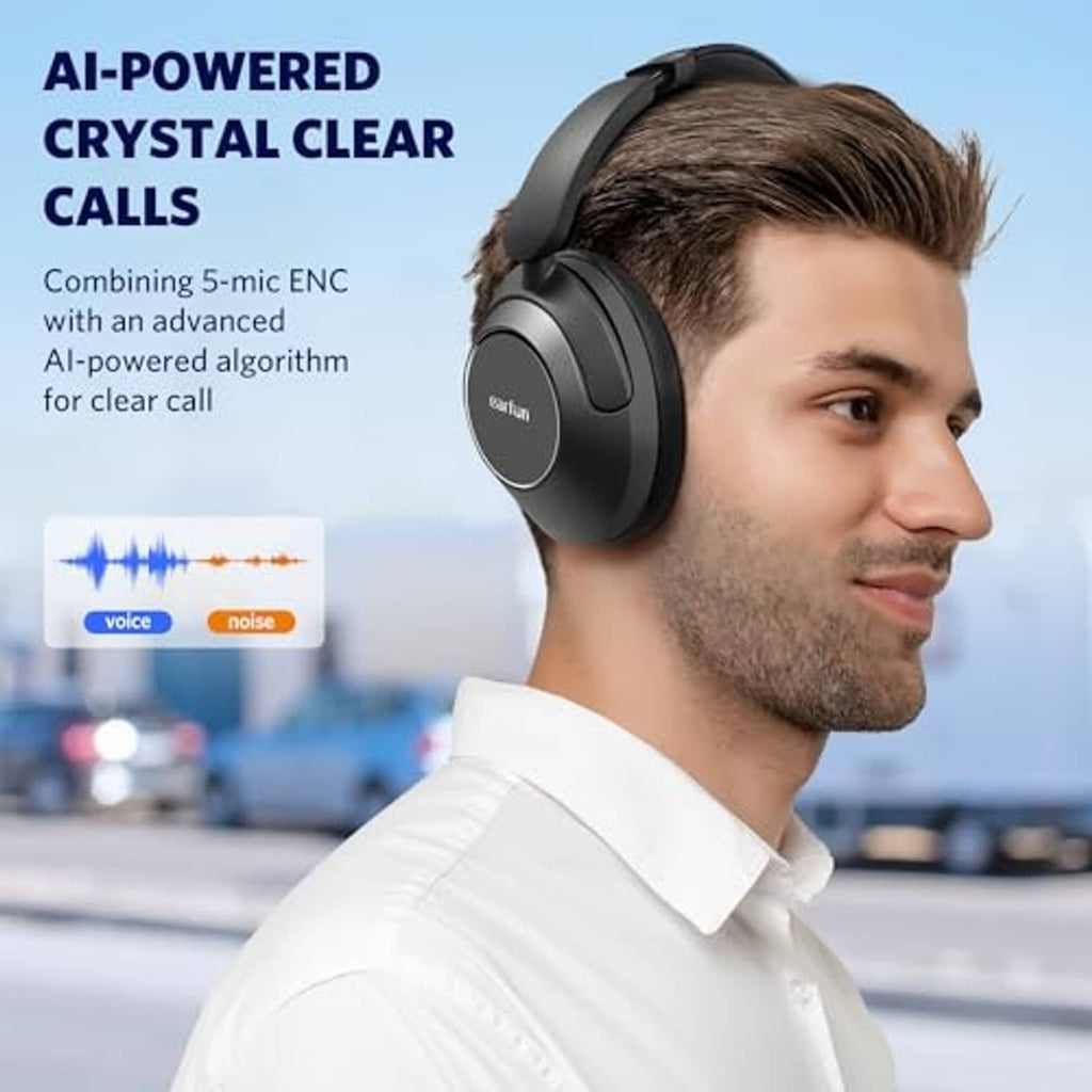 Black over-ear headphones on a person’s head with microphone highlights for calls