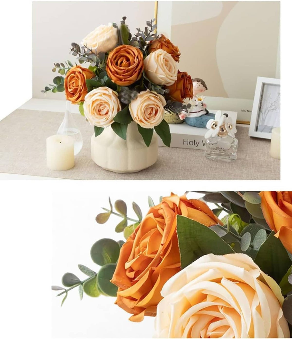 Artificial silk rose arrangement in cream vase with orange and white blooms and small angel figurines