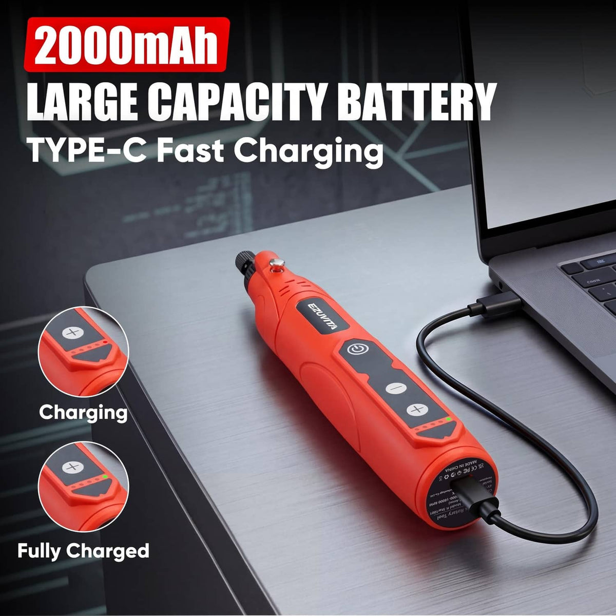 Red rotary tool with charging cable connected, shown on desk beside laptop