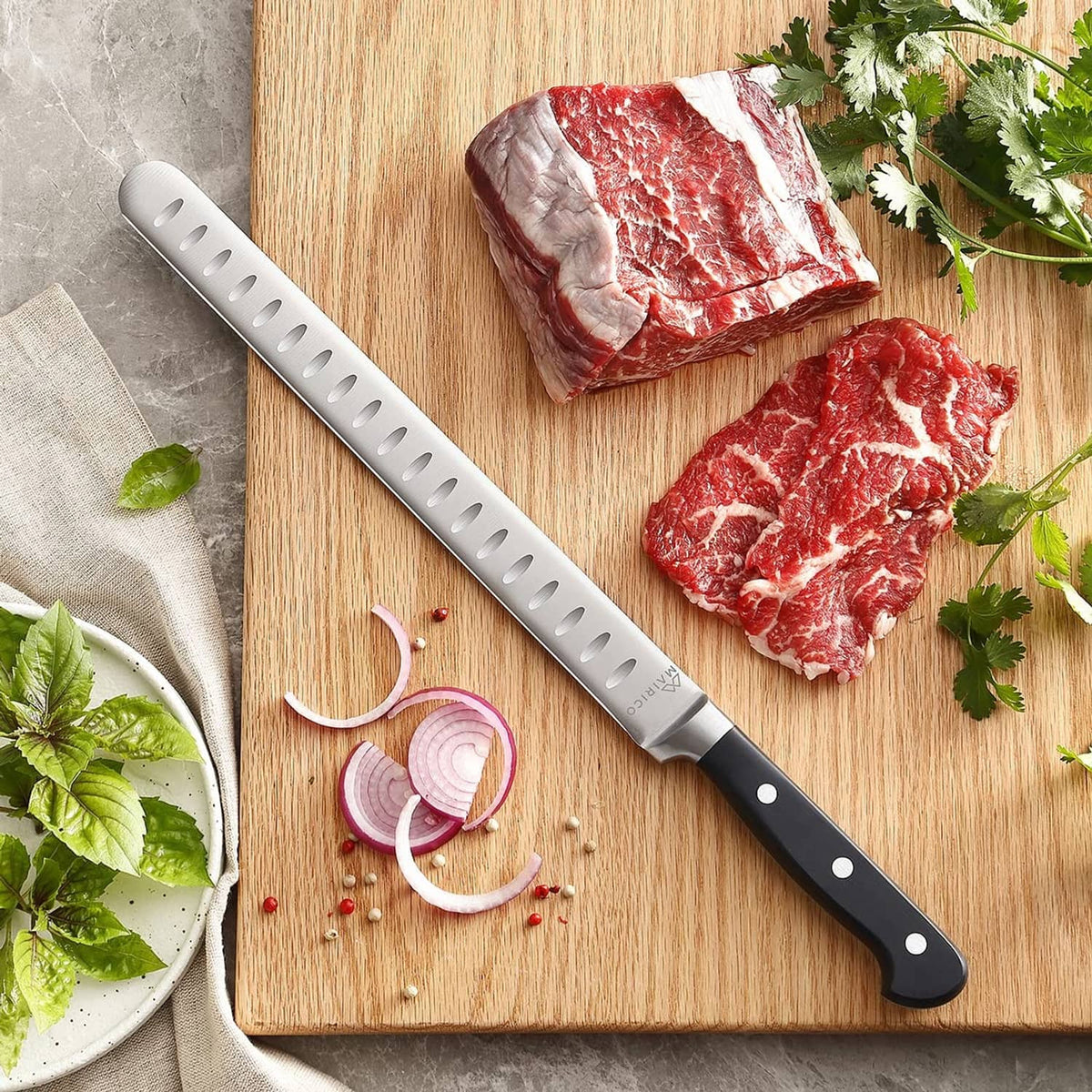 Mairico brisket slicing knife on wooden board beside sliced beef and herbs