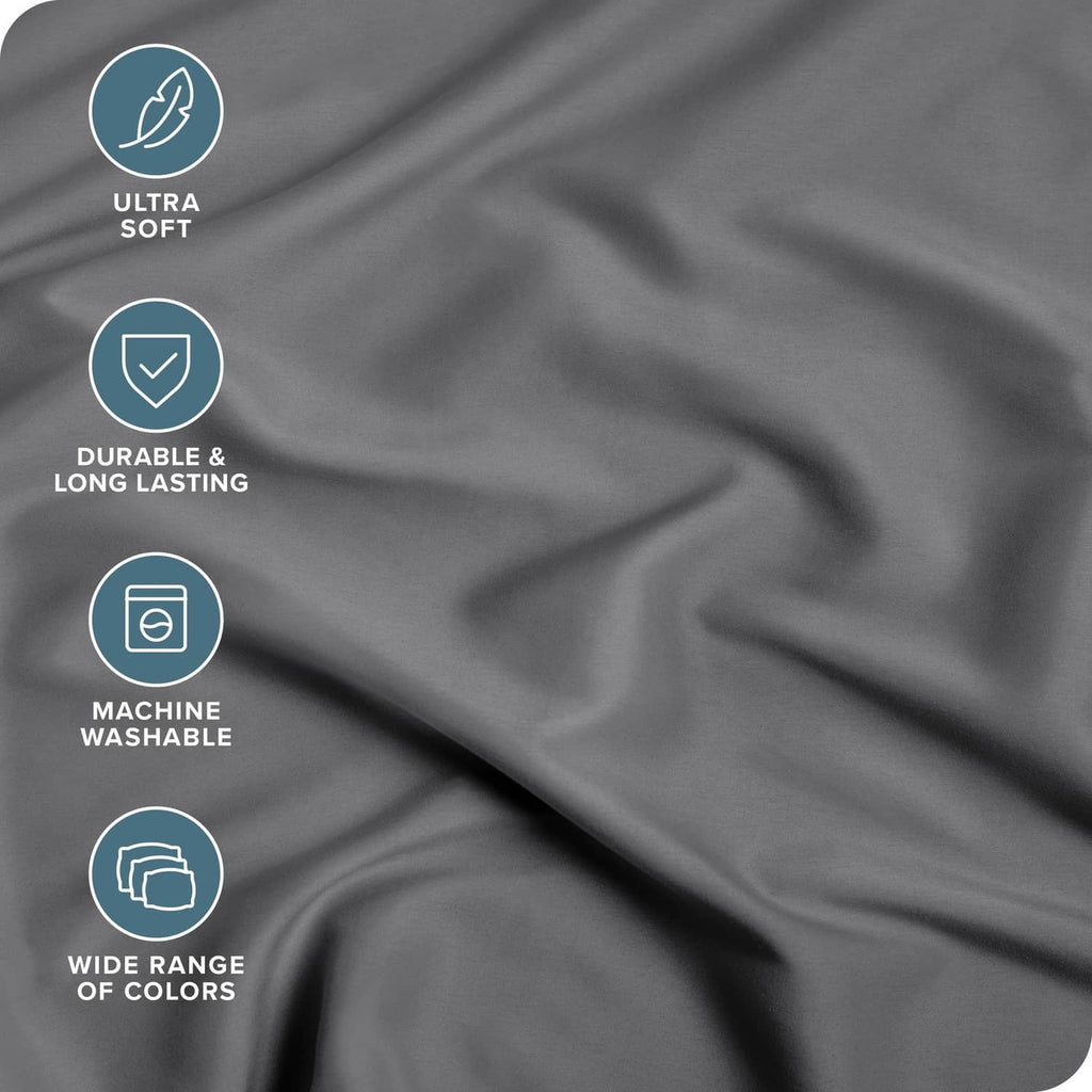 Grey fitted sheet fabric close-up, smooth microfiber weave