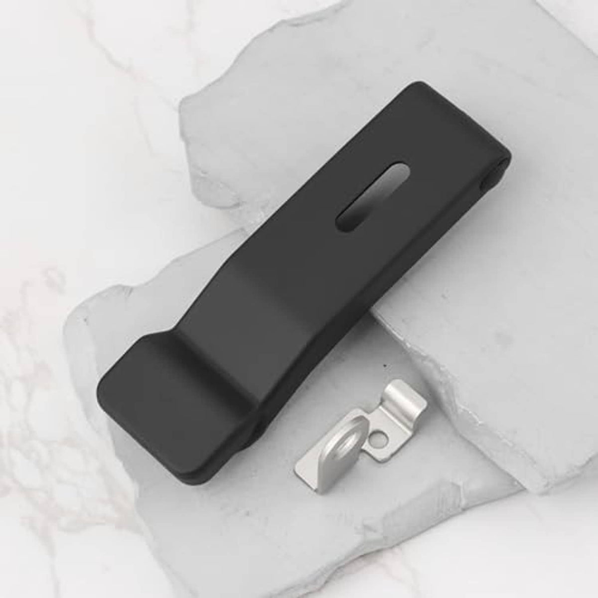 Black rubber latch bar with silver mounting bracket and metal clips on white base