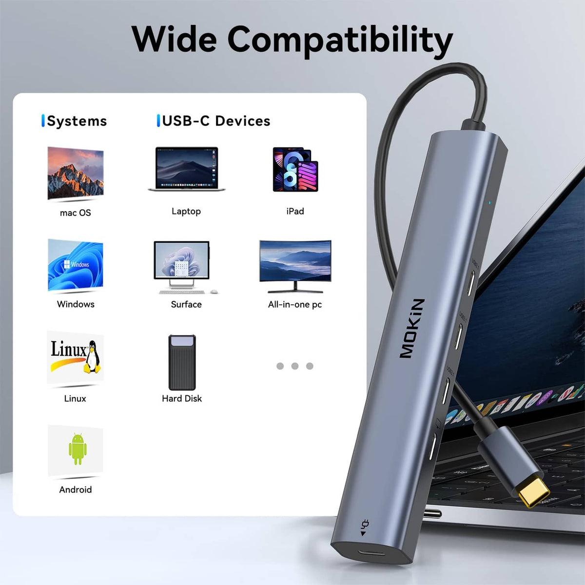 Metallic gray USB-C hub with a USB-C cable inserted and side ports visible