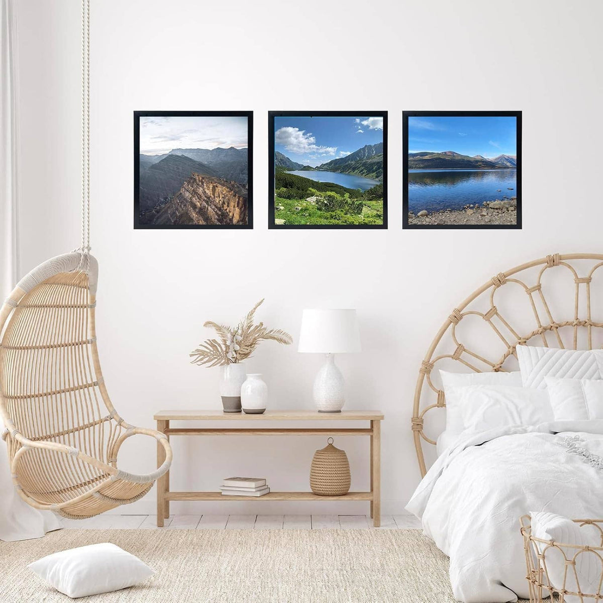 Black photo frame showing a landscape mountain scene, wall-mounted