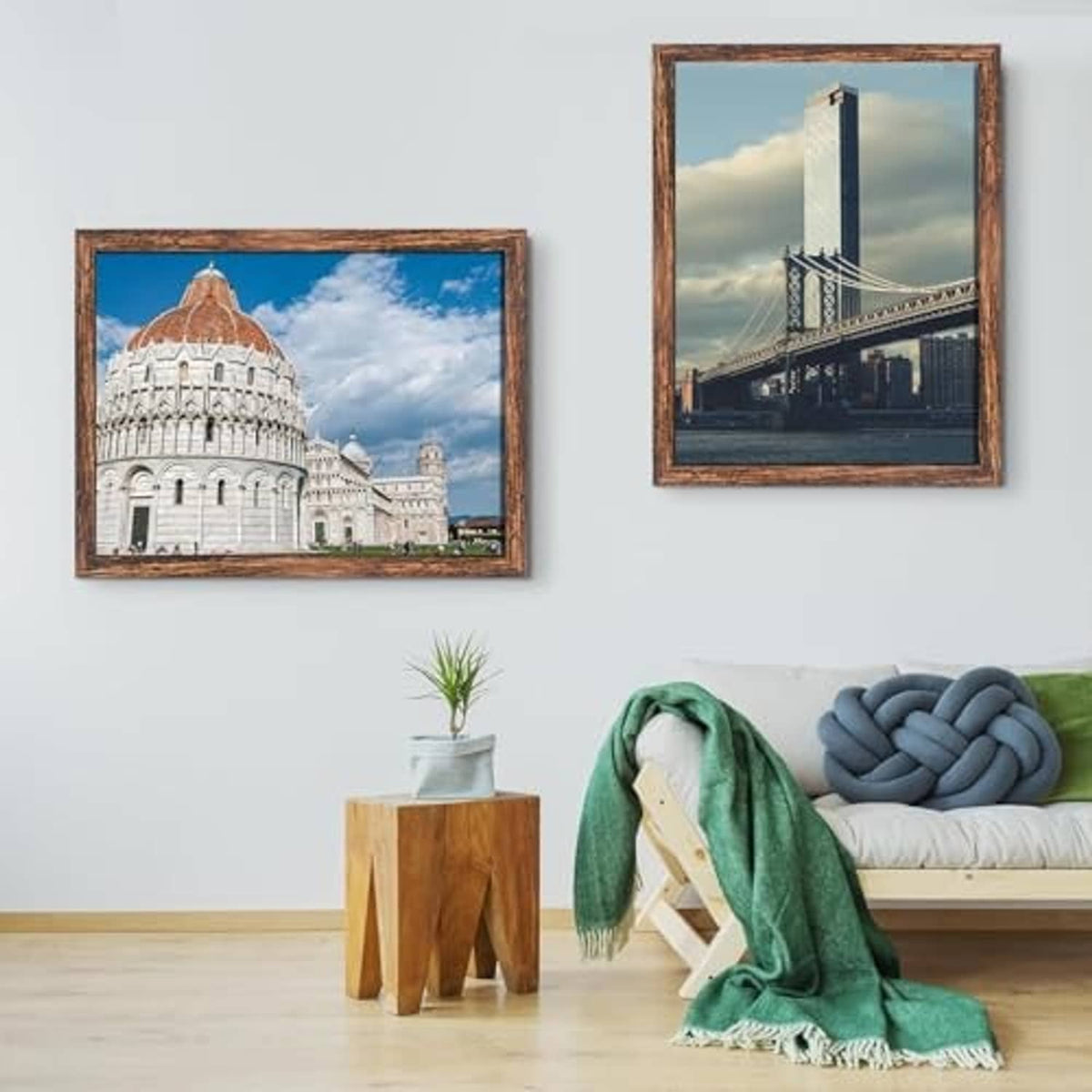 Brown poster frames set, wall-hung with two landscape artworks and glass fronts