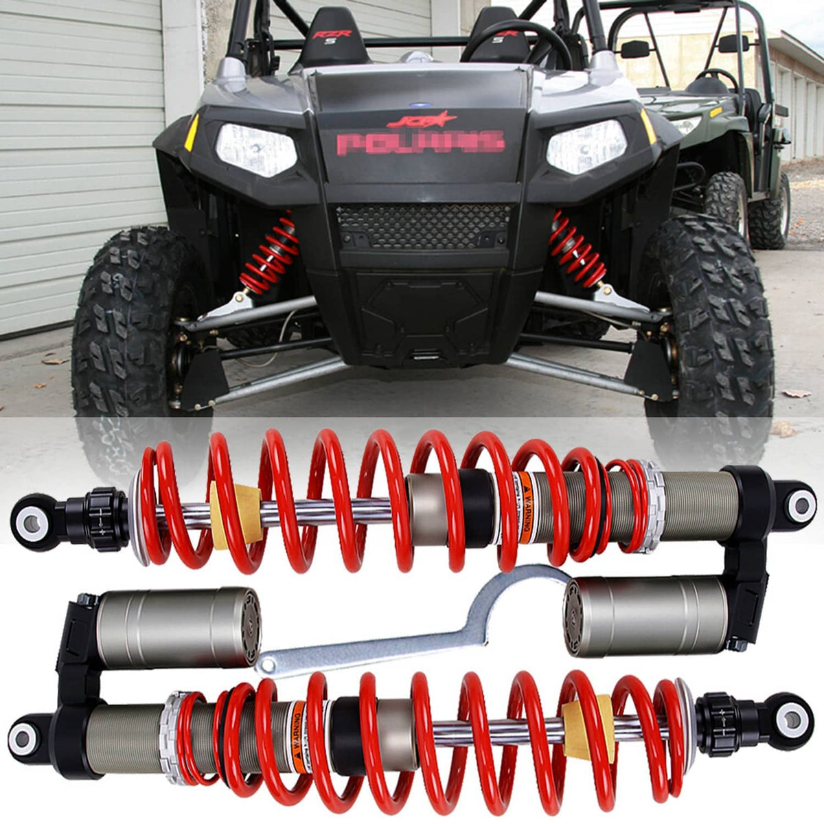 Front shock absorber pair installed on a UTV; red coil springs with gray damping cylinders
