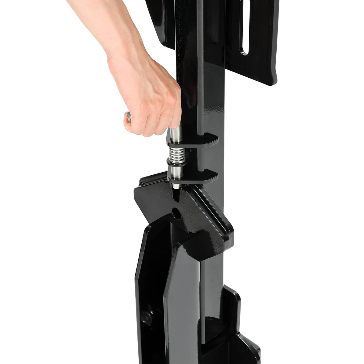 Close-up of black spare tire carrier mounting area with threaded rod and clamp bracket