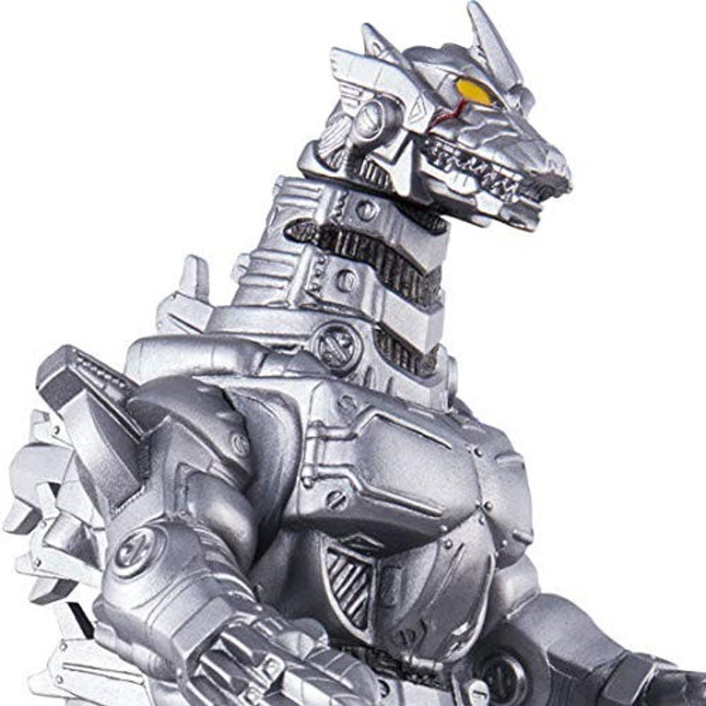 Close-up of silver mechanic monster vinyl figure, detailed armor and orange eye