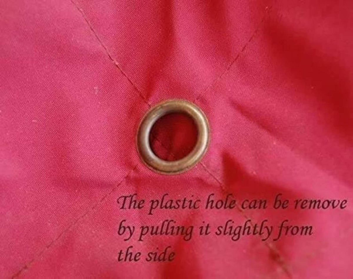 Red canopy fabric with removable plastic grommet ring near center hole