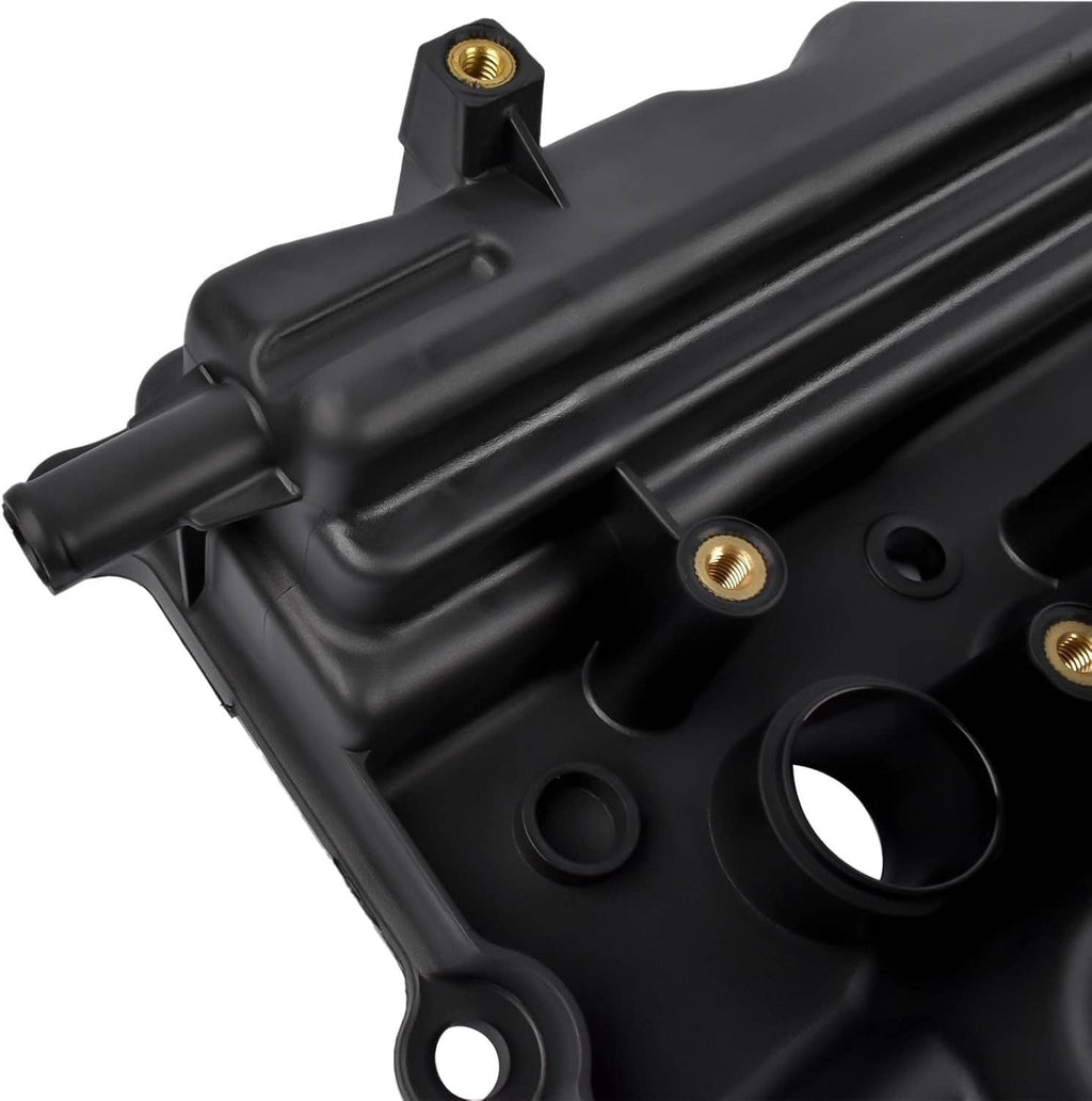 Close-up of black valve cover edge with threaded mounting hole and recessed features.