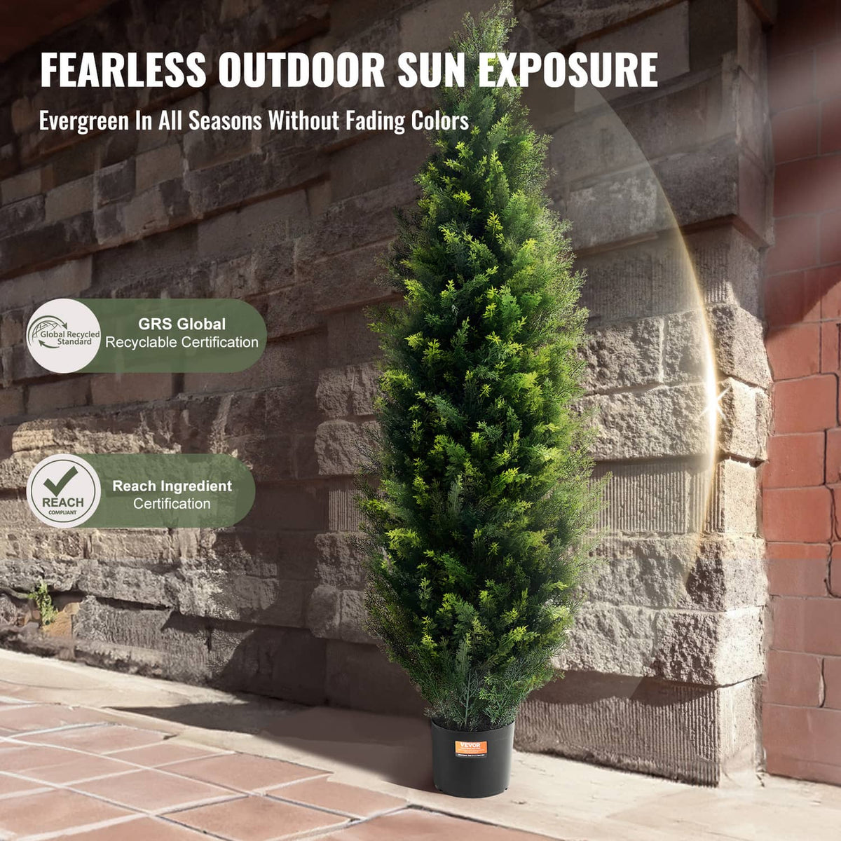 Artificial cedar topiary tree with dense green foliage in a black plastic pot