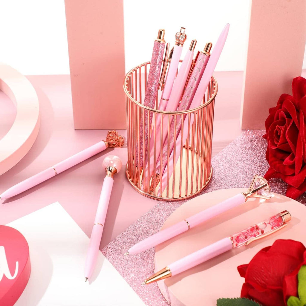 Pink glitter ballpoint pens set in metal holder, featuring crystal-like decorative tops