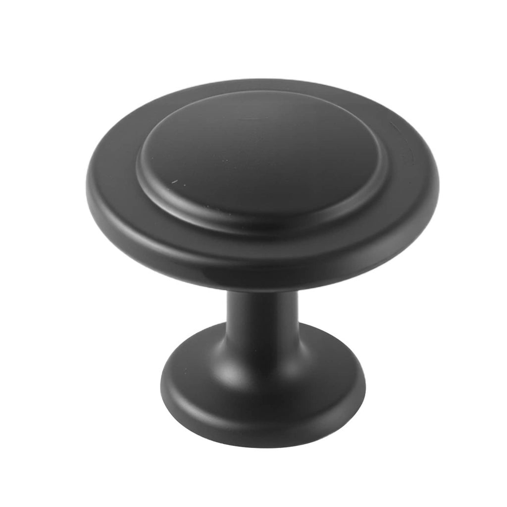 Close-up of matte black mushroom cabinet knob with round cap and base