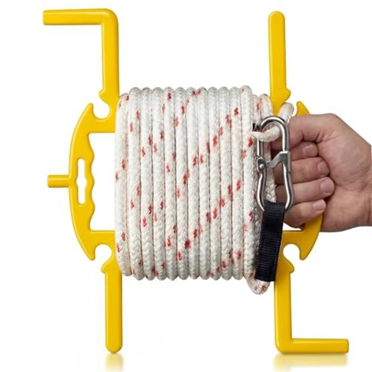Large cord spool winder with handle, winding white rope with red flecks and locking strap.