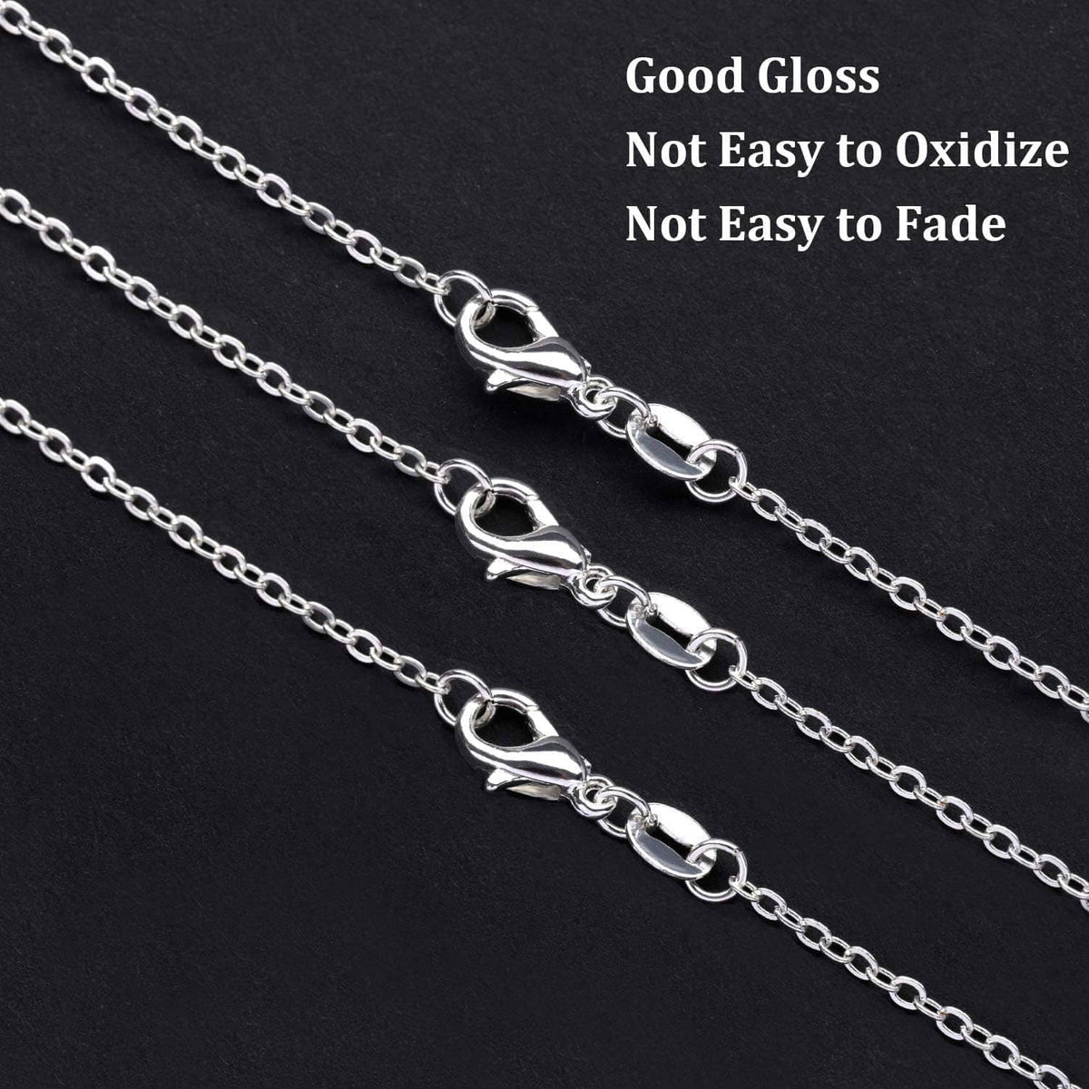 Silver-plated oval link necklace chain with glossy finish, close-up view.