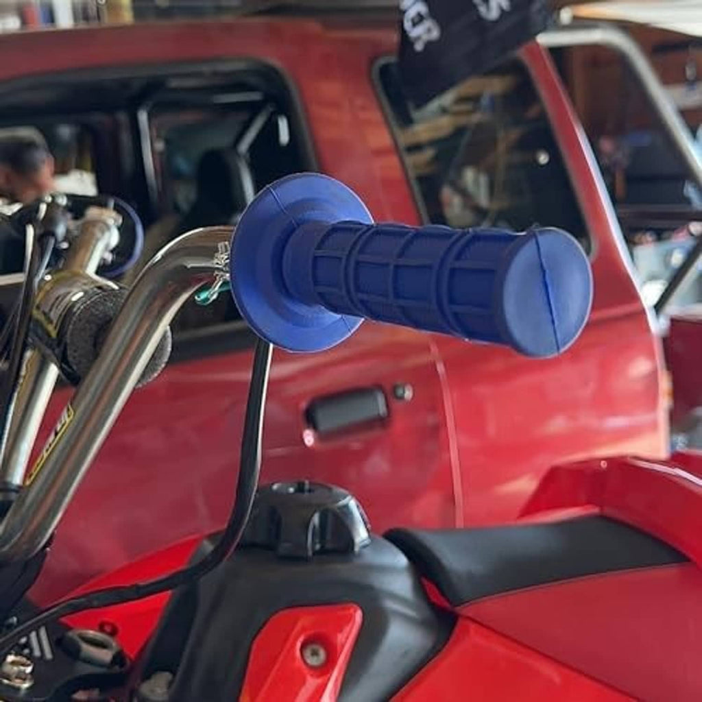 Blue textured motorcycle handlebar grips installed on a bike’s handlebar