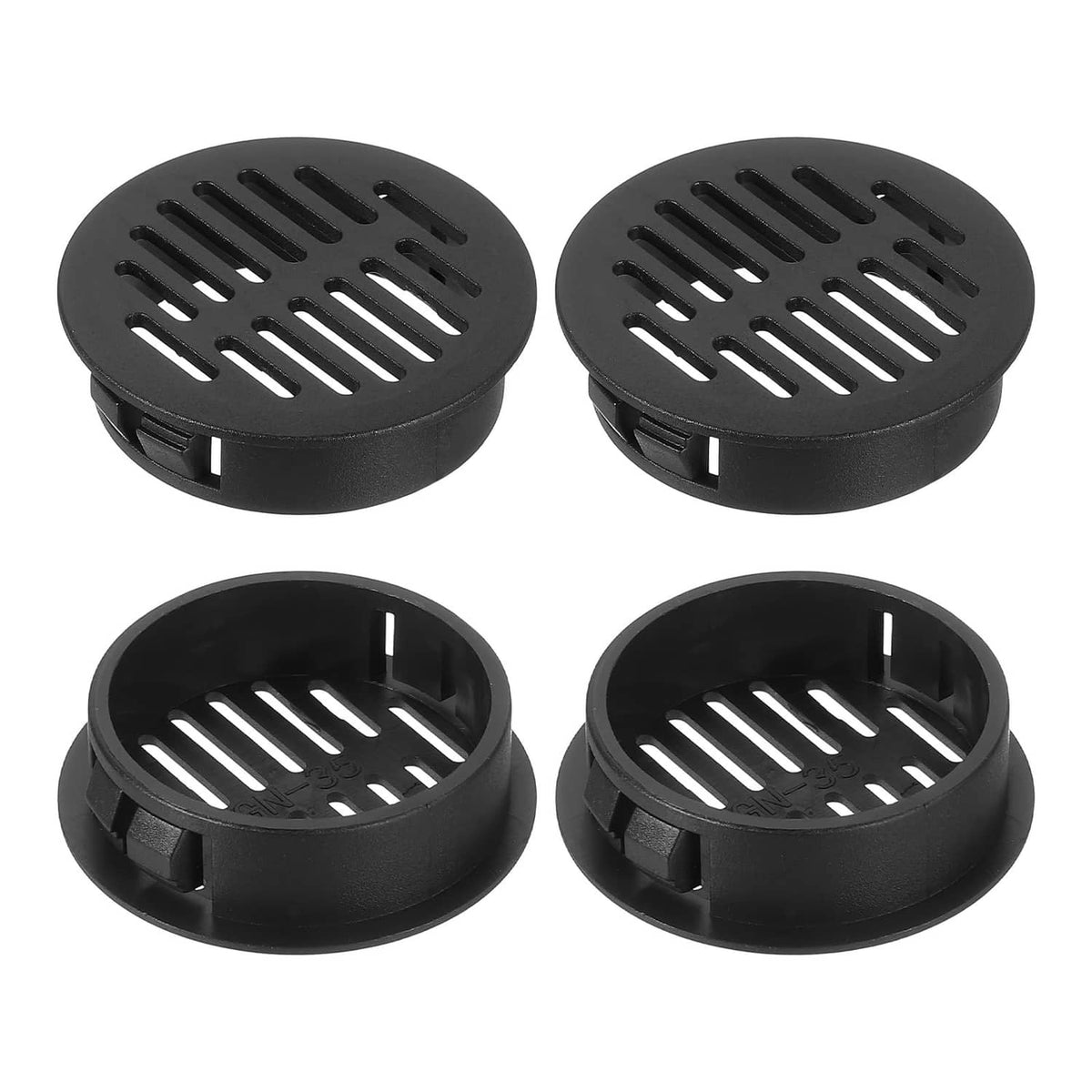 Round black plastic soffit vent covers with slotted grille openings (4 shown)
