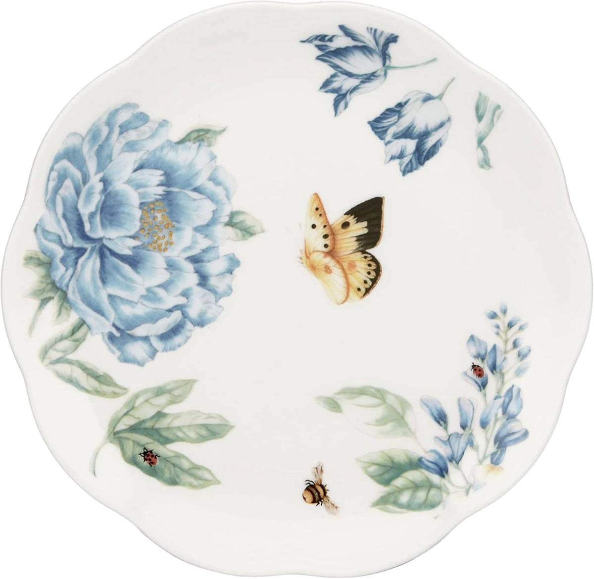 Round dessert plate with large blue floral design, butterflies, and green leaves on white.