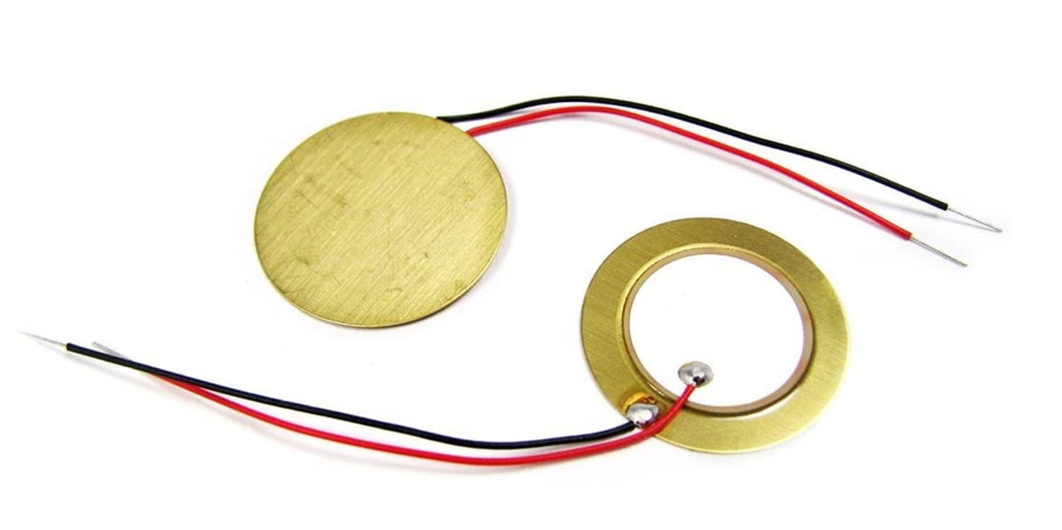 Two piezo disc pickups with red/black wire leads, circular metal faces