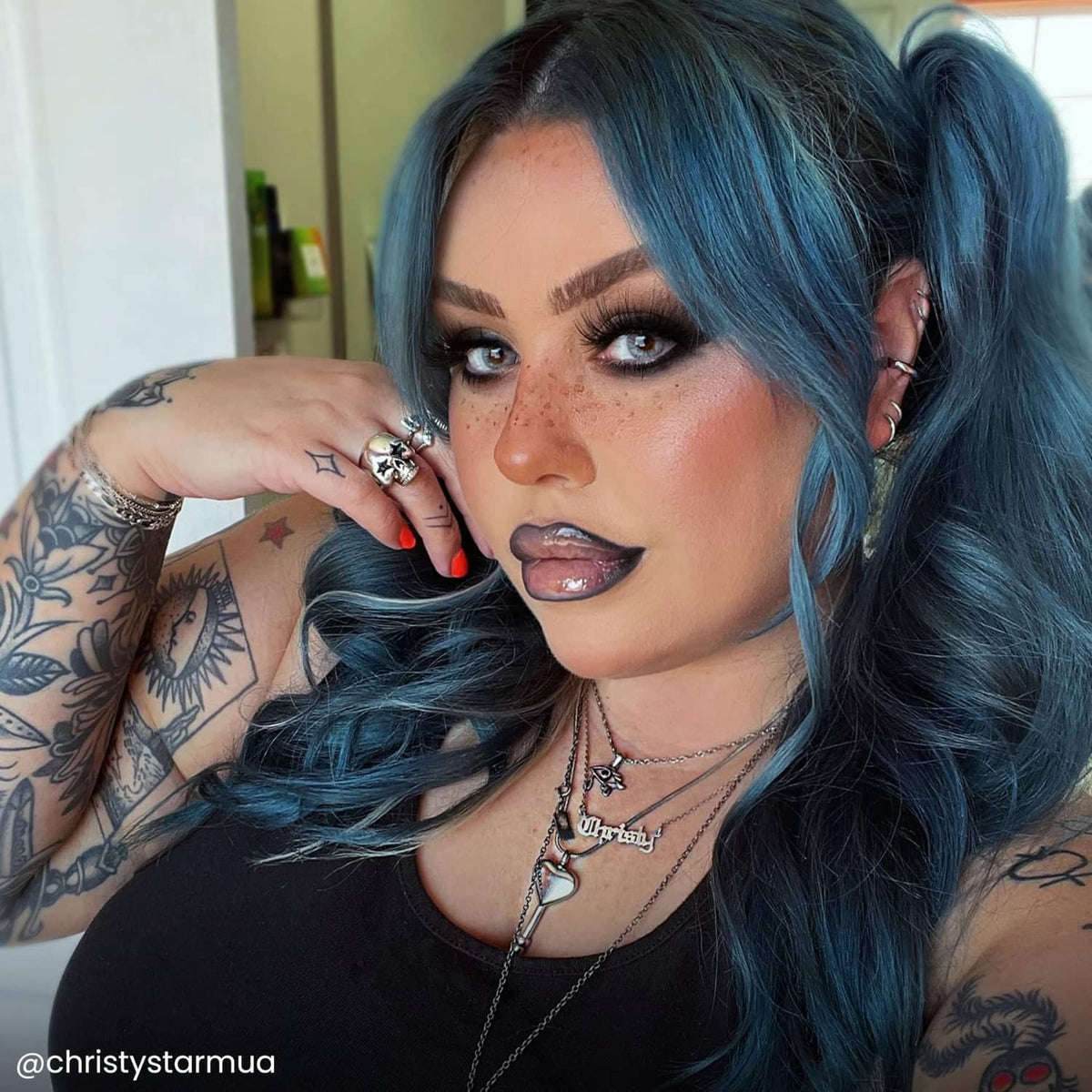 Semi-permanent hair color result: dark teal-blue hair with lighter blue blend