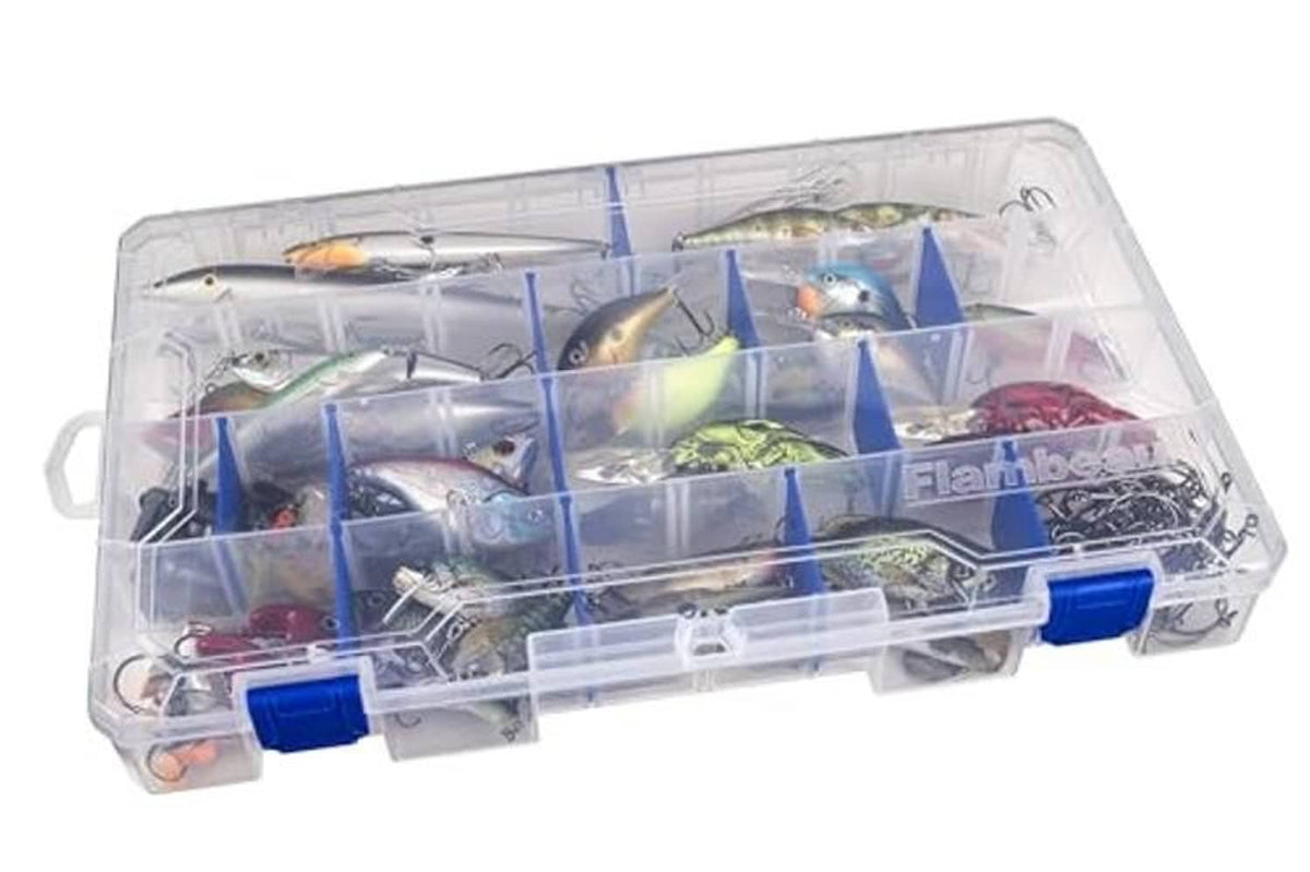 Clear tackle box with blue dividers filled with assorted fishing lures