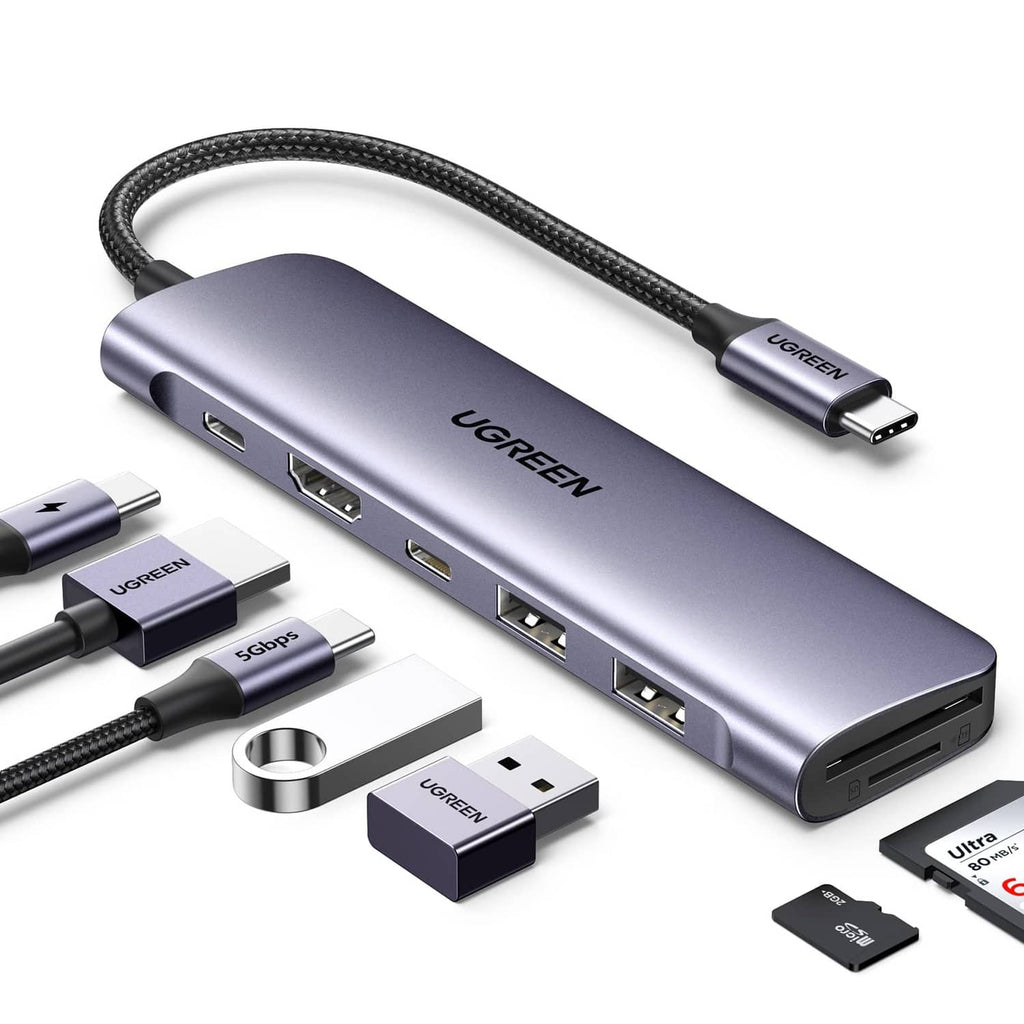 Space gray USB-C laptop docking hub with braided cable and HDMI/USB ports