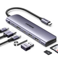 Space gray USB-C laptop docking hub with braided cable and HDMI/USB ports