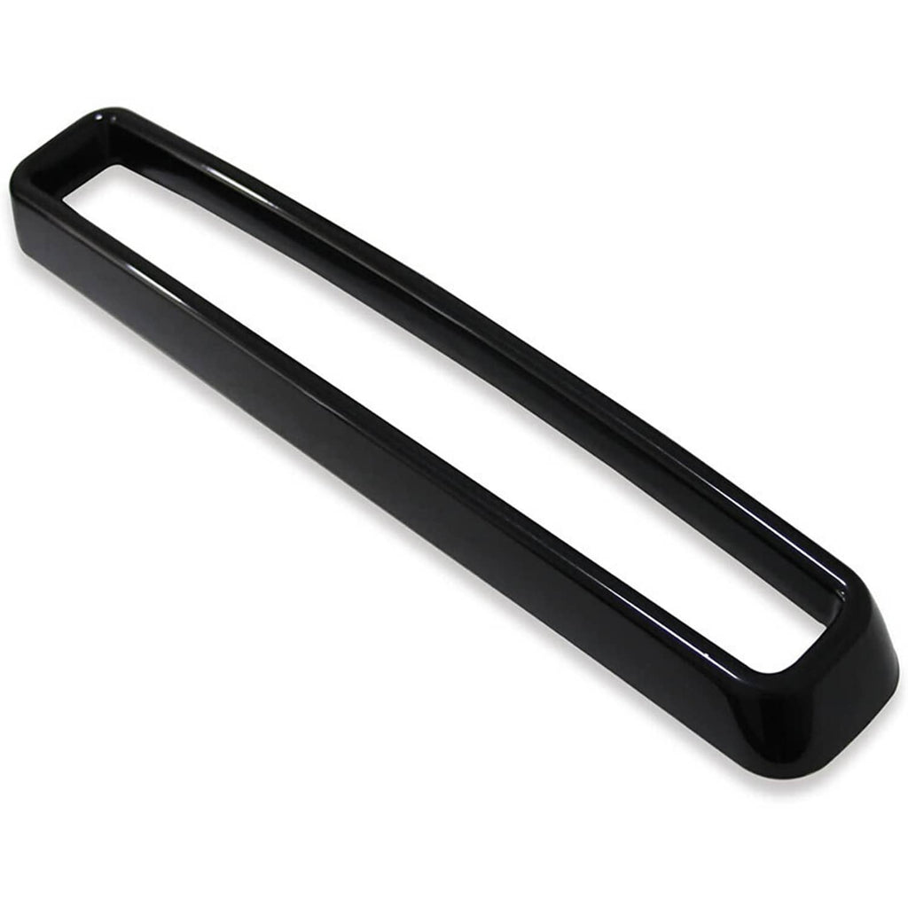 Single black grille insert trim with rectangular open center and glossy edging